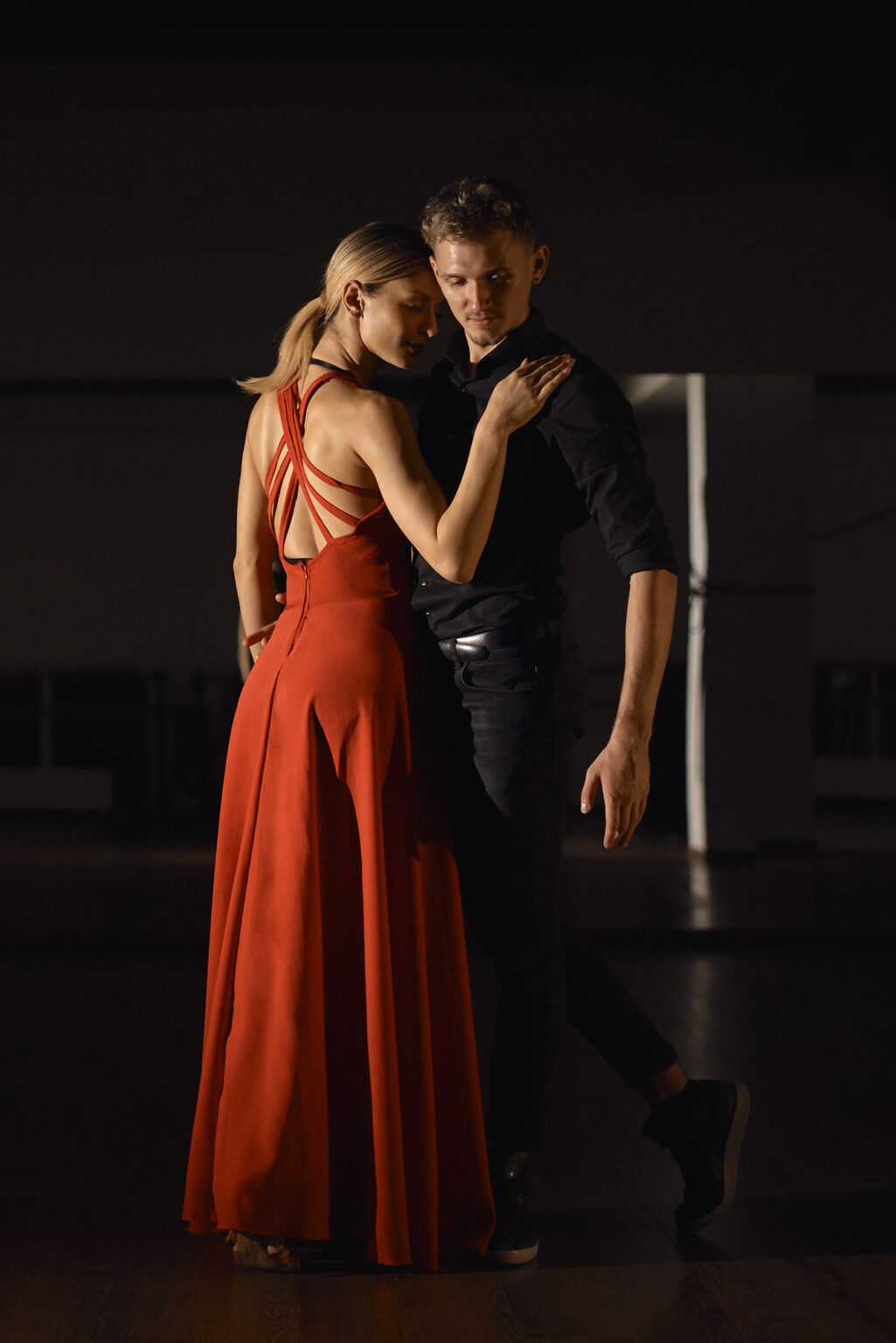 Young beautiful couple dancing with passion